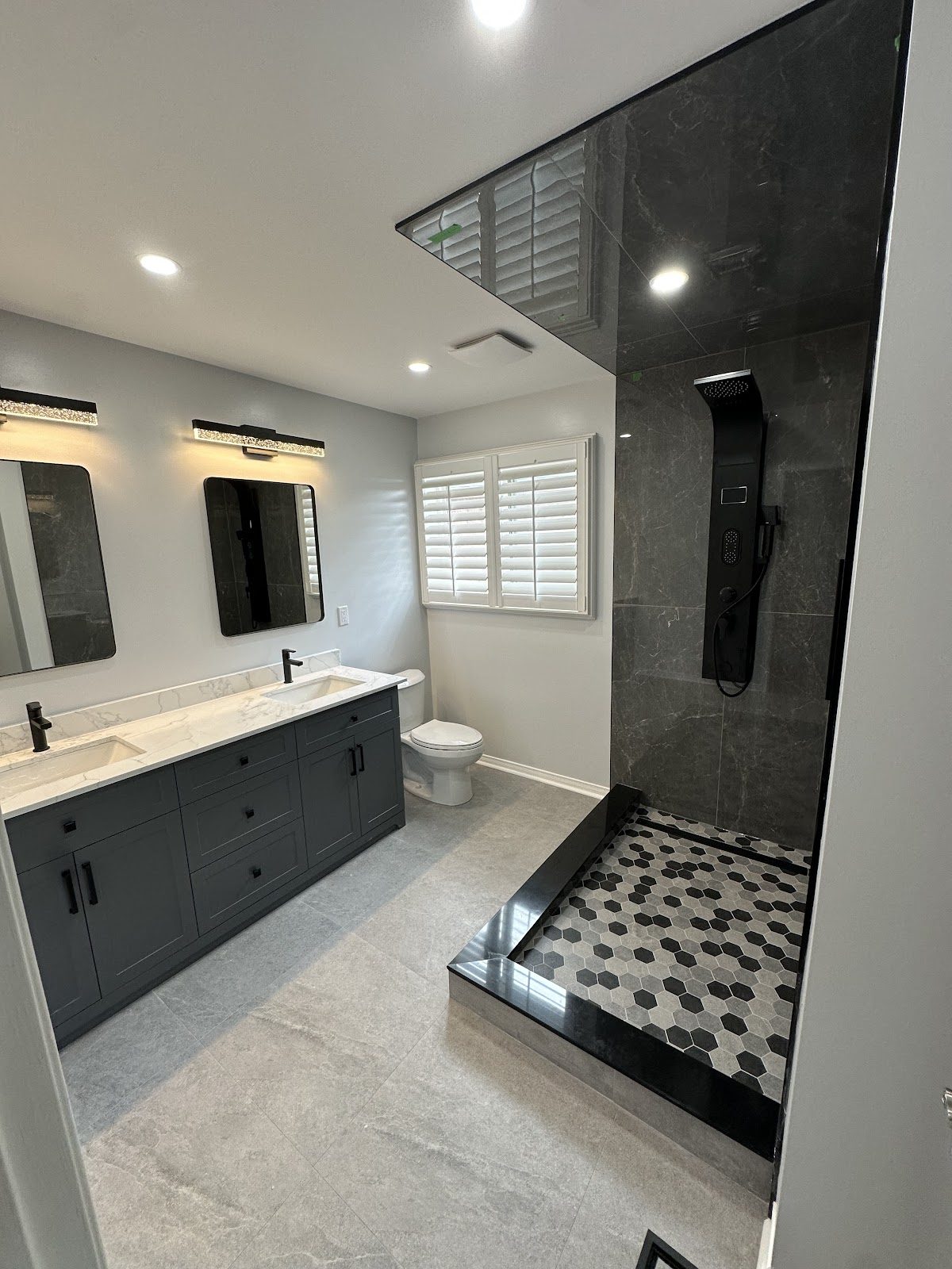 Real completed bathroom renovation with walk-in shower